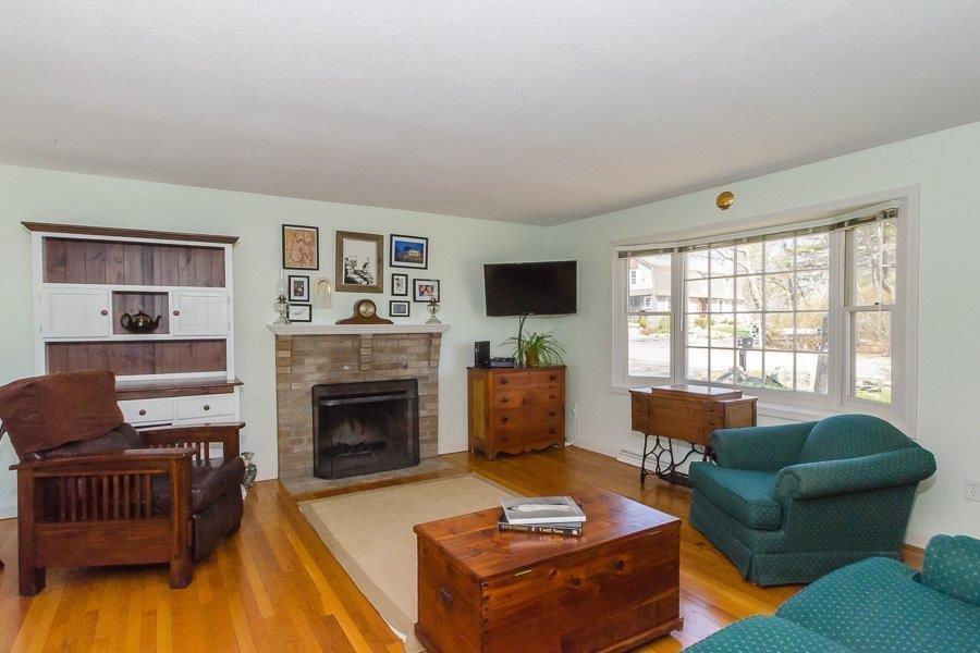 62 Converse Road Marion, MA 02738 - Photo 4 of 14 a living room with furniture and a fireplace