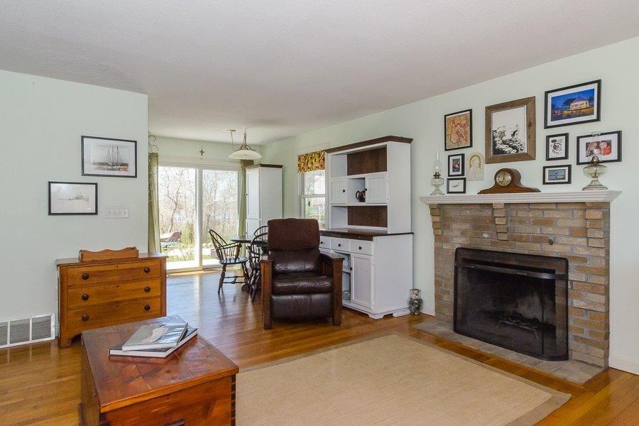 62 Converse Road Marion, MA 02738 - Photo 5 of 14 a living room with furniture and a fireplace