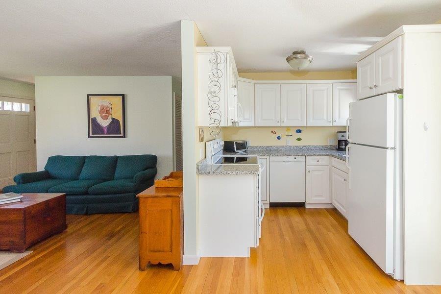 62 Converse Road Marion, MA 02738 - Photo 7 of 14 a kitchen with stainless steel appliances granite countertop a refrigerator a stove and a cabinets