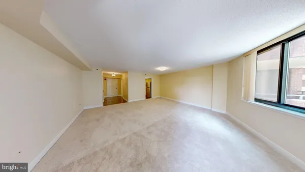 a view of hallway with walk in closet