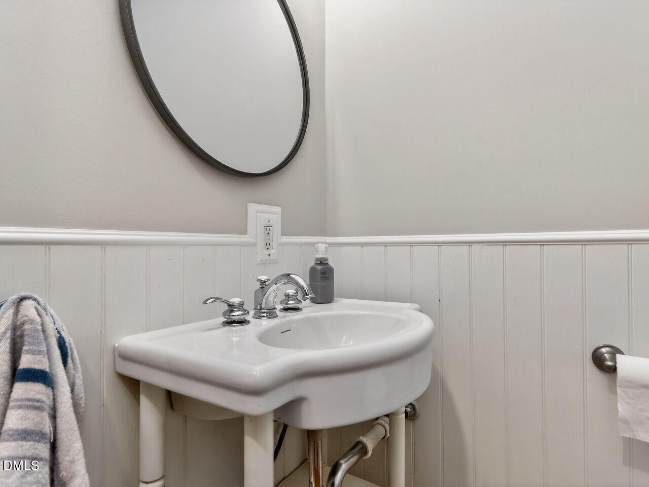 6004 Tarnhour Court Raleigh, NC 27612 - Photo 15 of 44 a bathroom with a sink and a mirror