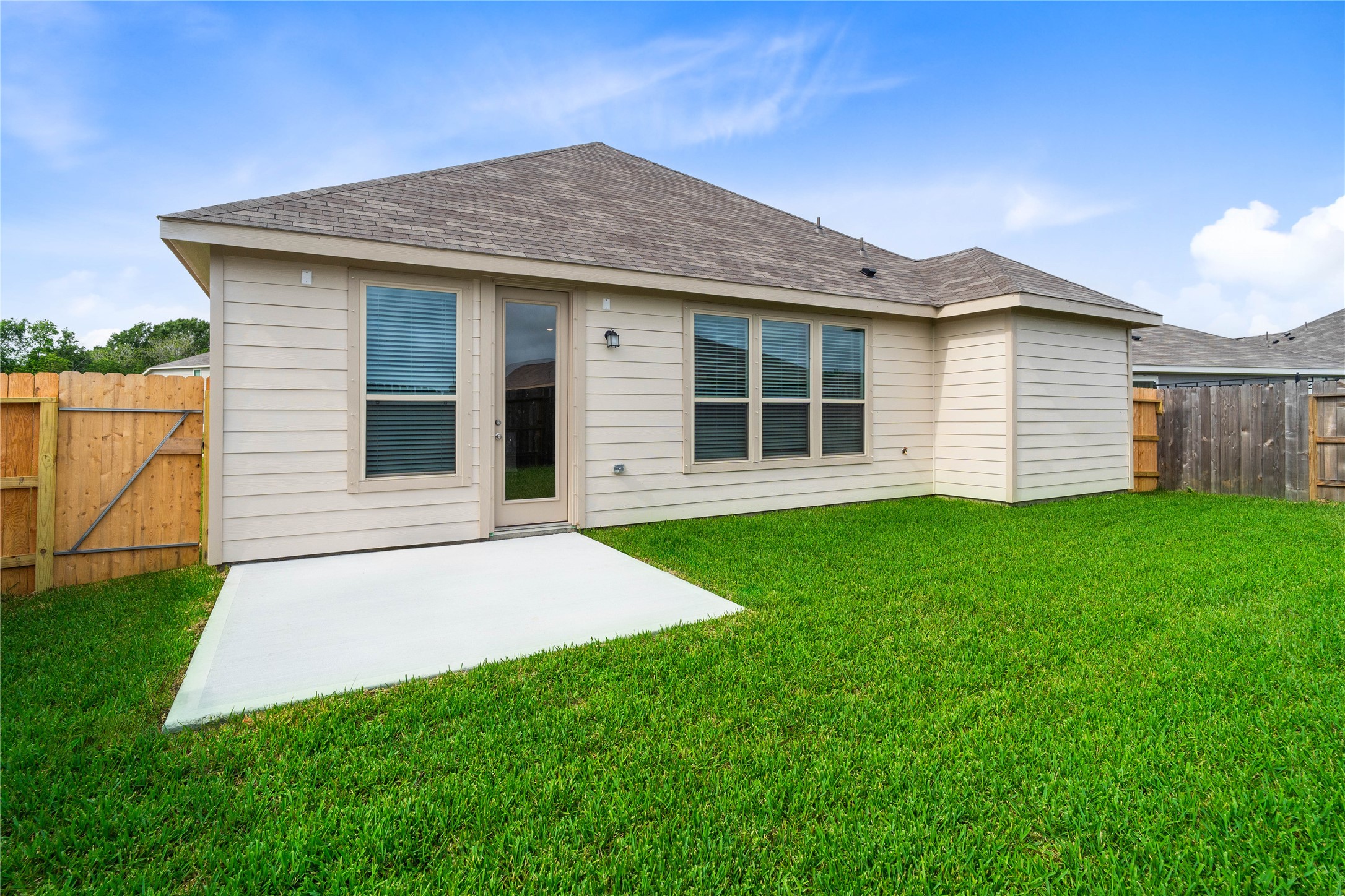 745 Imperial Loop Alvin, TX 77511 - Photo 24 of 29 a front view of a house with a garden