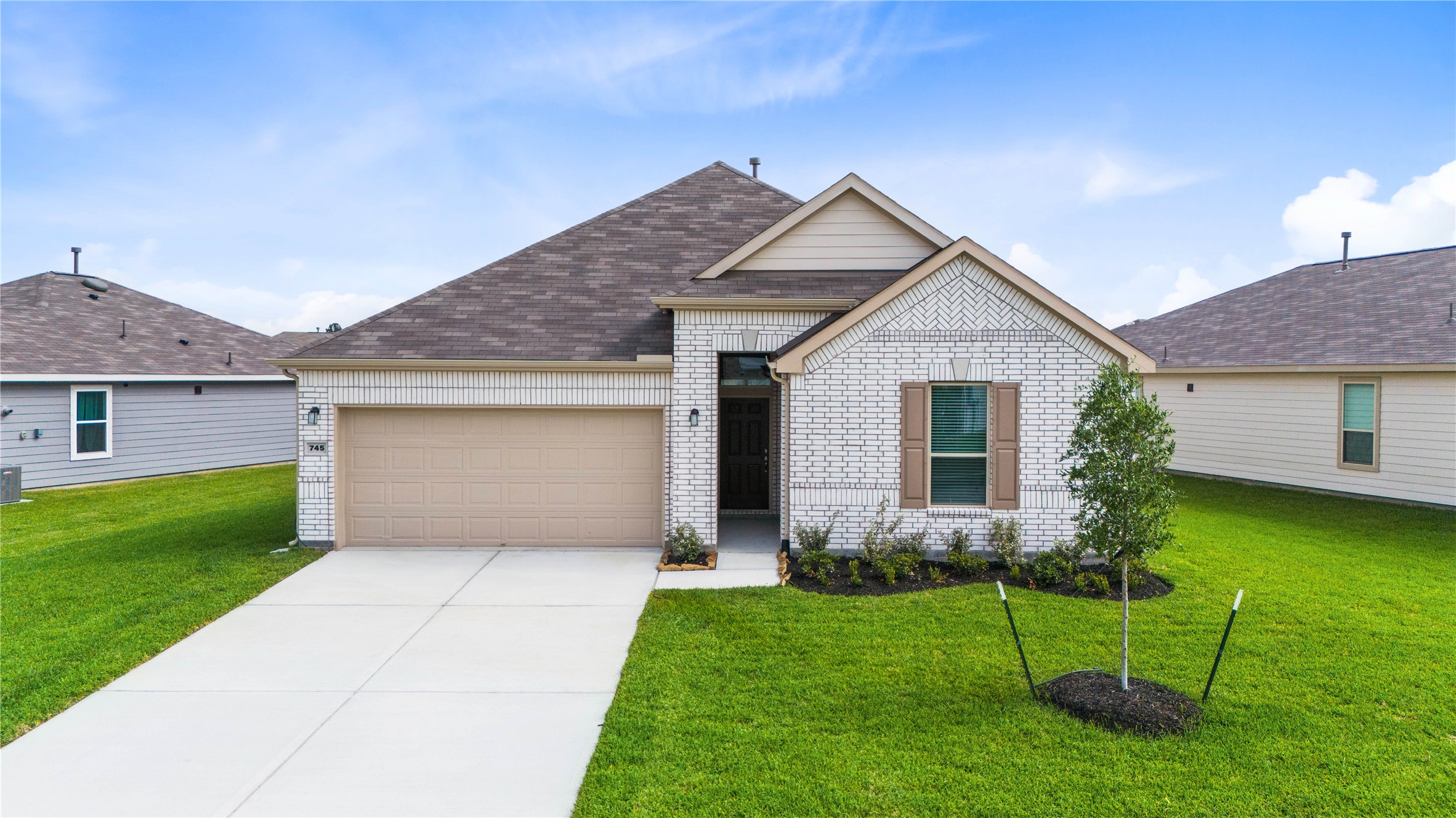 745 Imperial Loop Alvin, TX 77511 - Photo 25 of 29 a front view of house with yard and green space