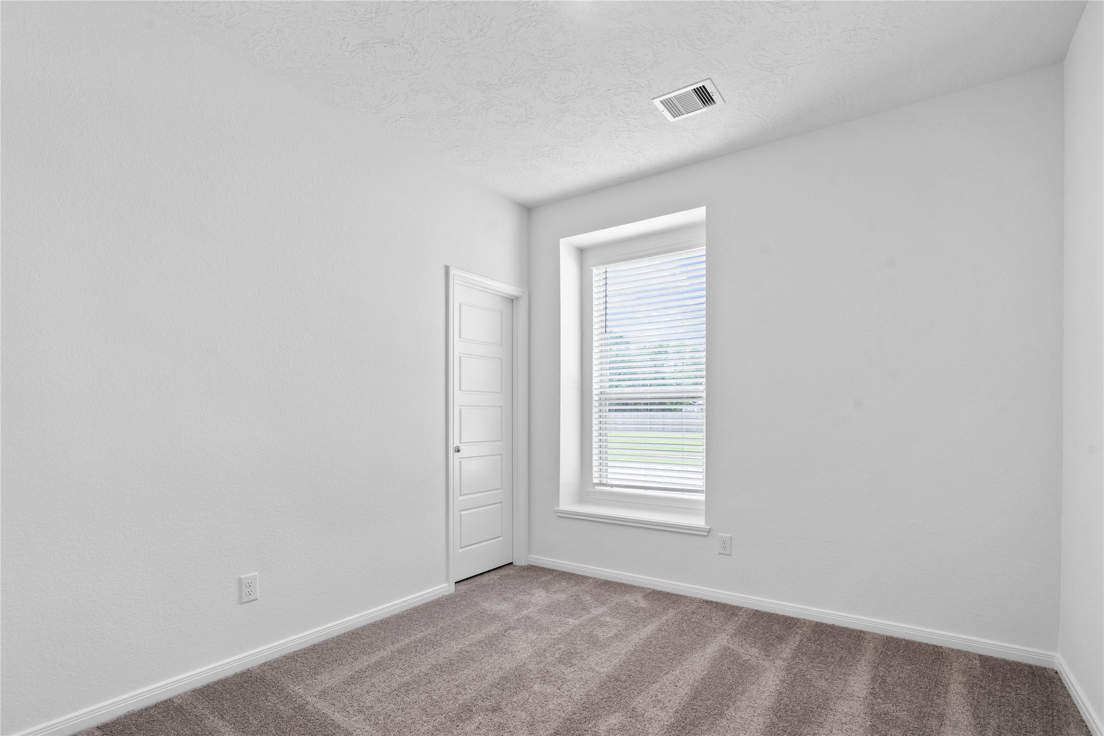745 Imperial Loop Alvin, TX 77511 - Photo 6 of 29 a view of an empty room with a window