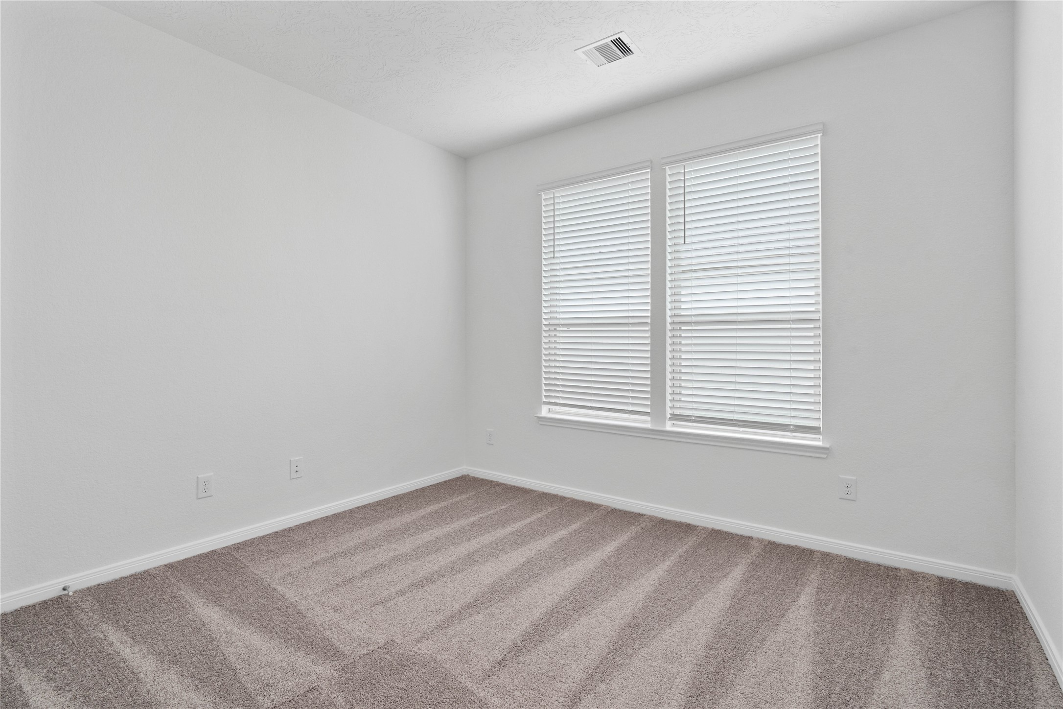 745 Imperial Loop Alvin, TX 77511 - Photo 8 of 29 an empty room with a window