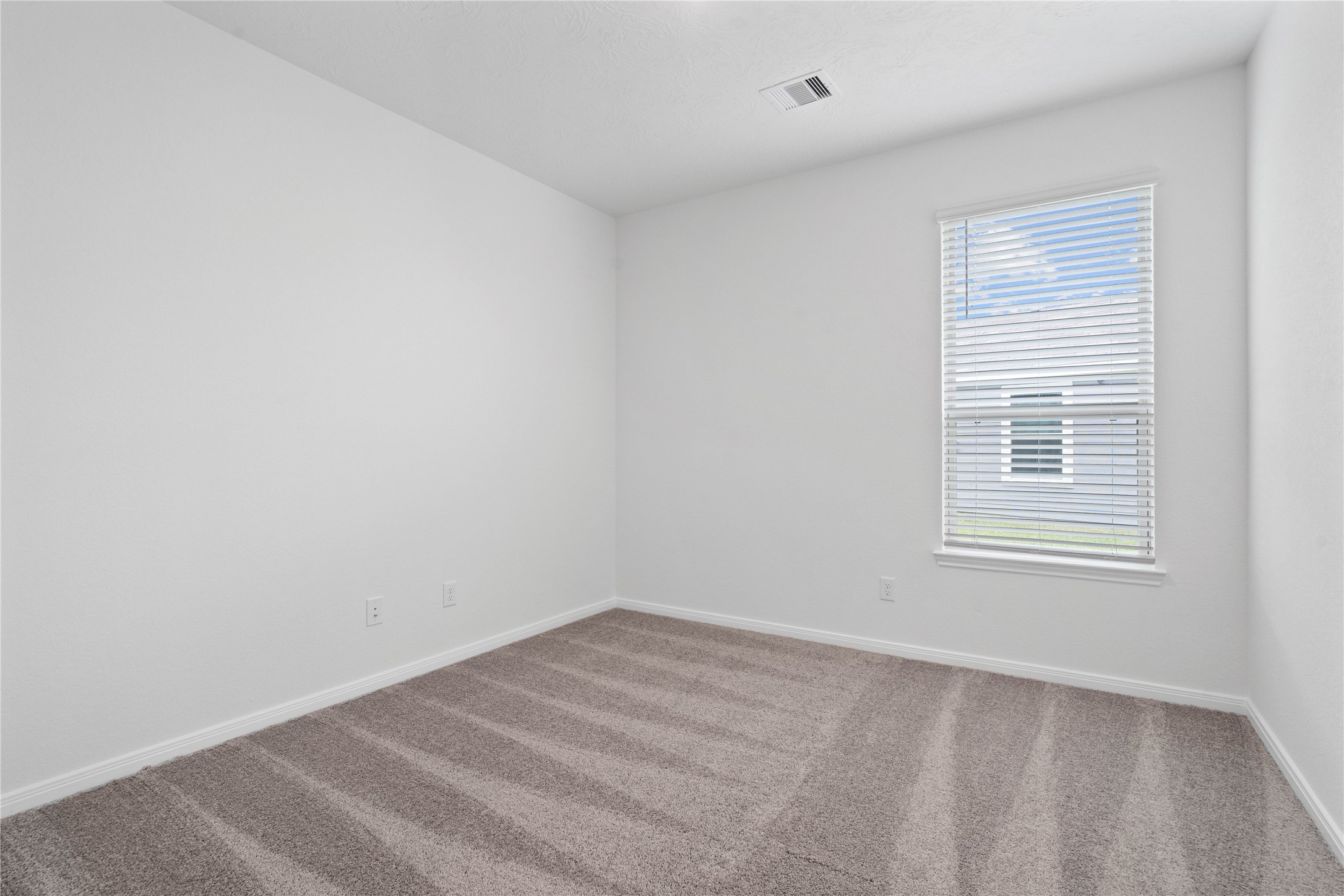 745 Imperial Loop Alvin, TX 77511 - Photo 9 of 29 a view of a room that has a window in it