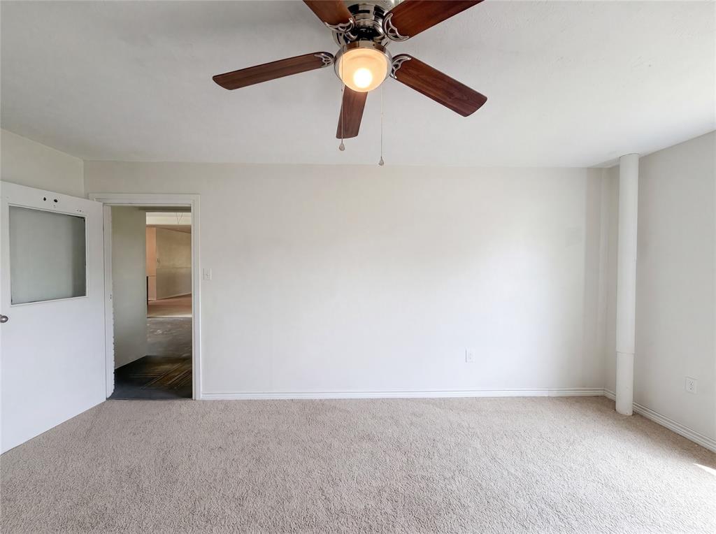 205 West Decatur Street Chico, TX 76431 - Photo 11 of 19 an empty room with closet and fan