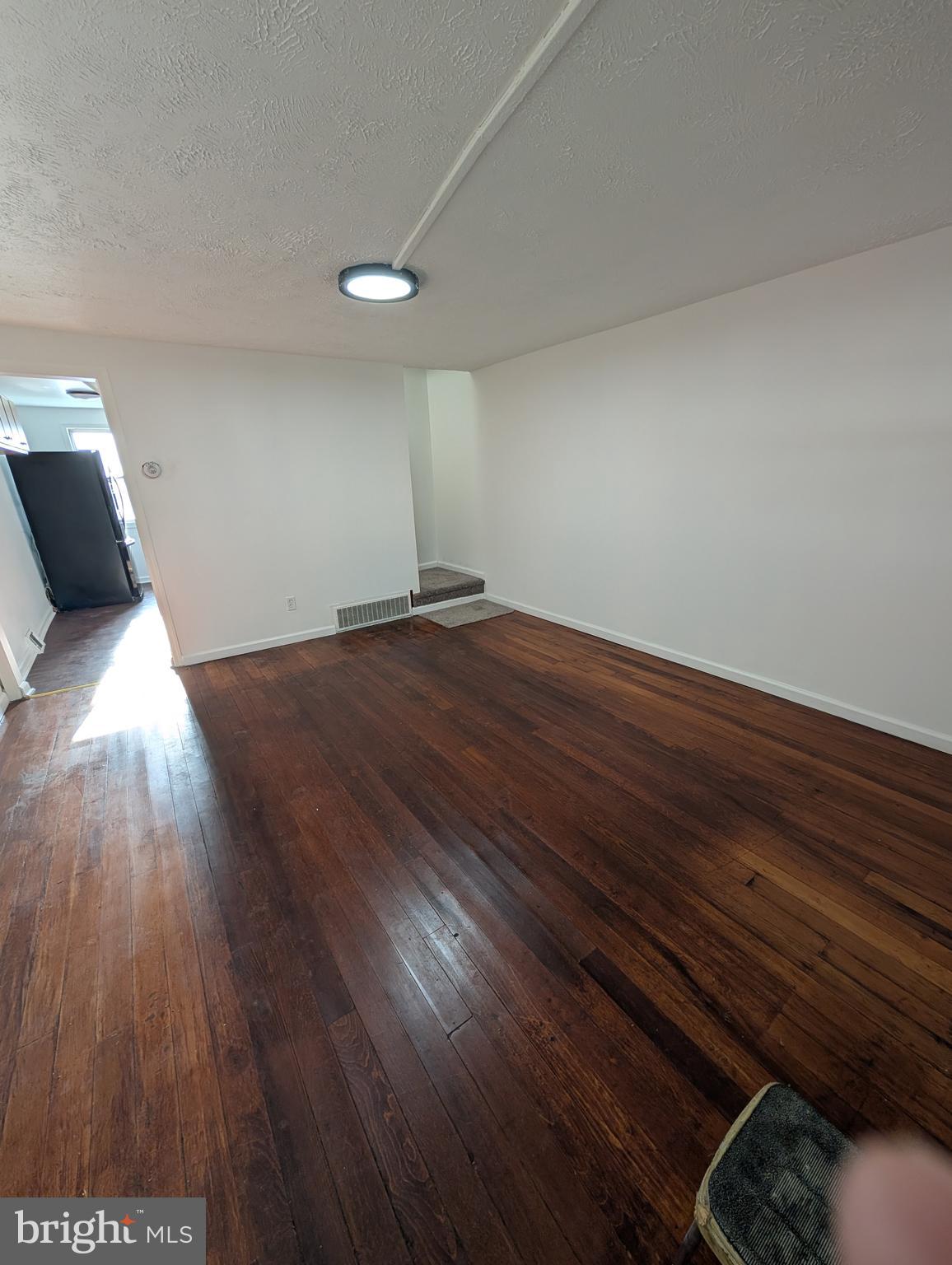 414 Avondale Road Dundalk, MD 21222 - Photo 17 of 29 a view of empty room with wooden floor