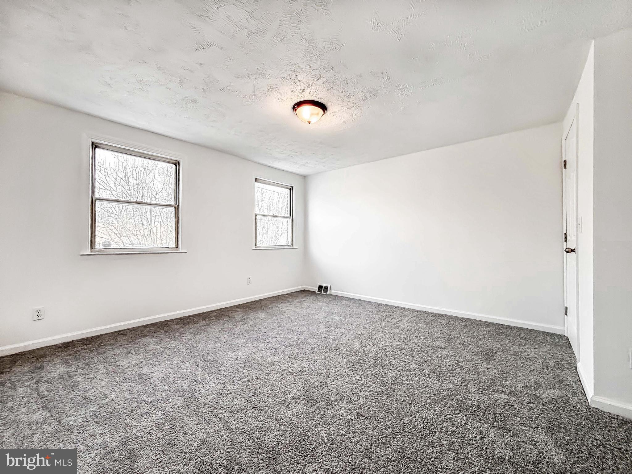 414 Avondale Road Dundalk, MD 21222 - Photo 25 of 33 an empty room with windows