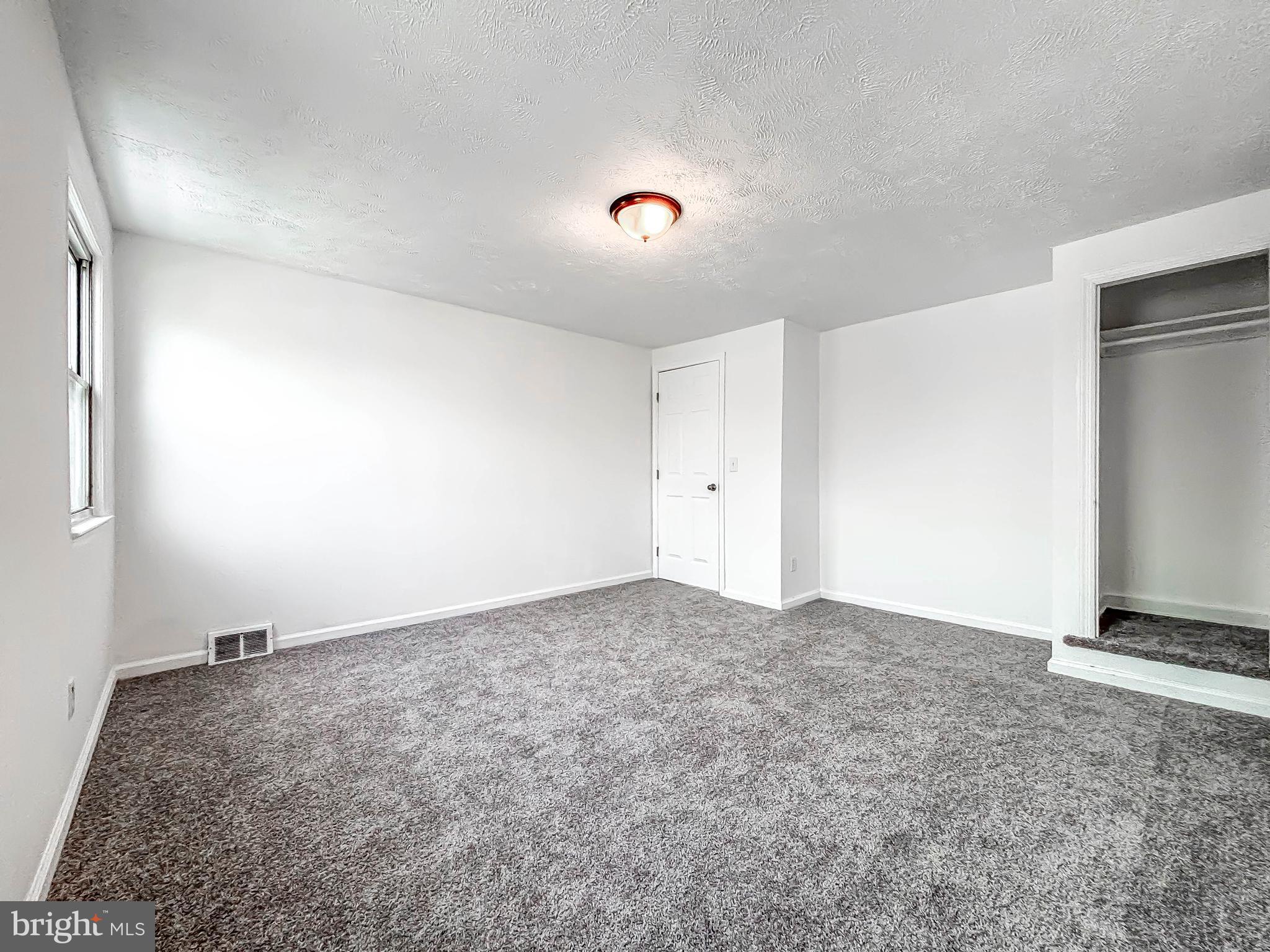 414 Avondale Road Dundalk, MD 21222 - Photo 27 of 33 a view of an empty room and kitchen