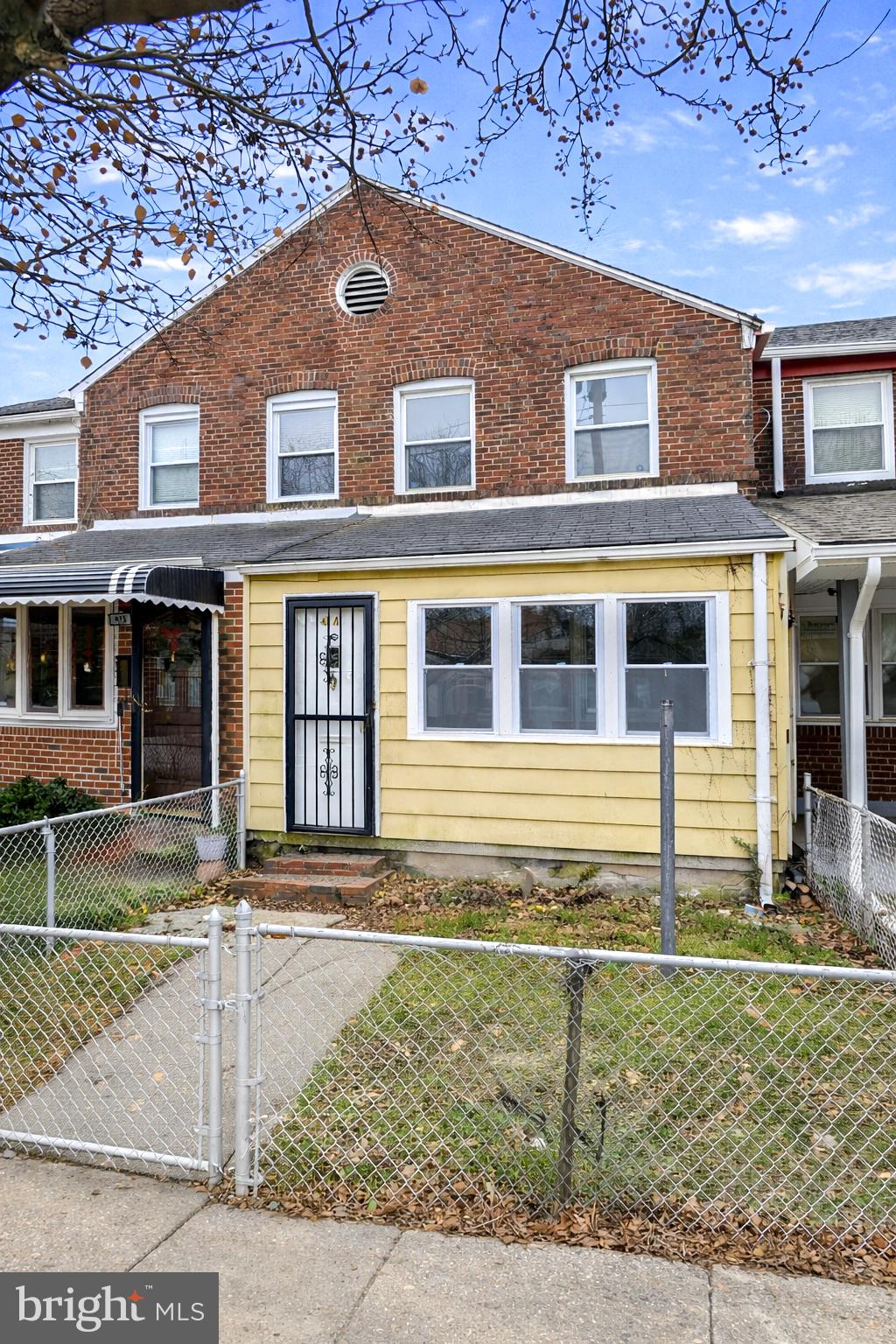 414 Avondale Road Dundalk, MD 21222 - Photo 28 of 28 front view of a brick house with a yard
