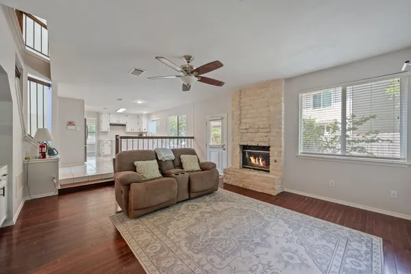 a living room with furniture and a fireplace