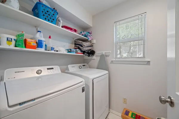a utility room with dryer and washer