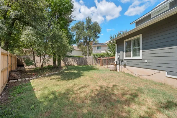 a view of backyard of a house