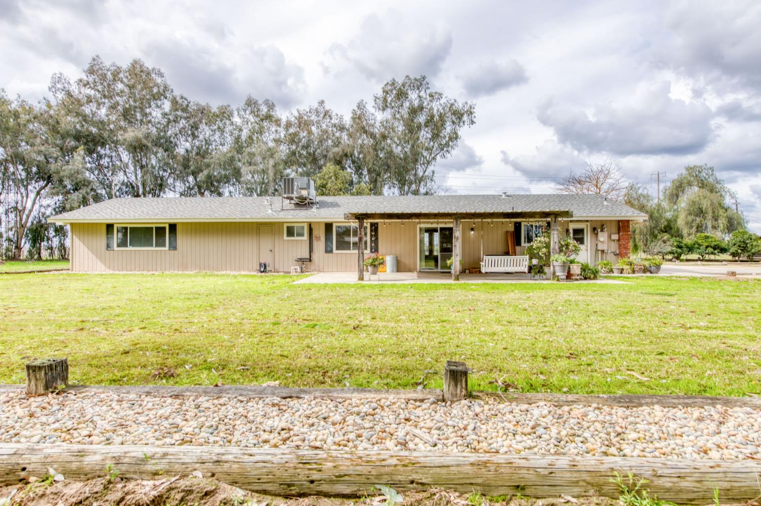 16036 South Del Rey Avenue Kingsburg, CA 93631 - Photo 16 of 64 a front view of a house with swimming pool
