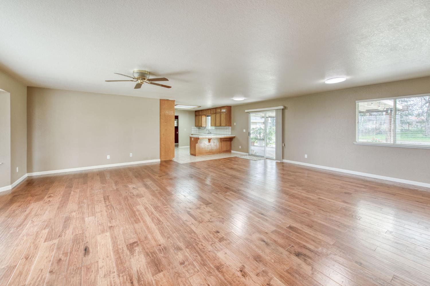16036 South Del Rey Avenue Kingsburg, CA 93631 - Photo 18 of 64 a view of empty room with wooden floor and fan