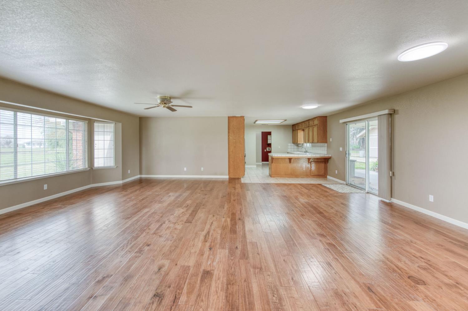 16036 South Del Rey Avenue Kingsburg, CA 93631 - Photo 19 of 64 a view of empty room with wooden floor and window