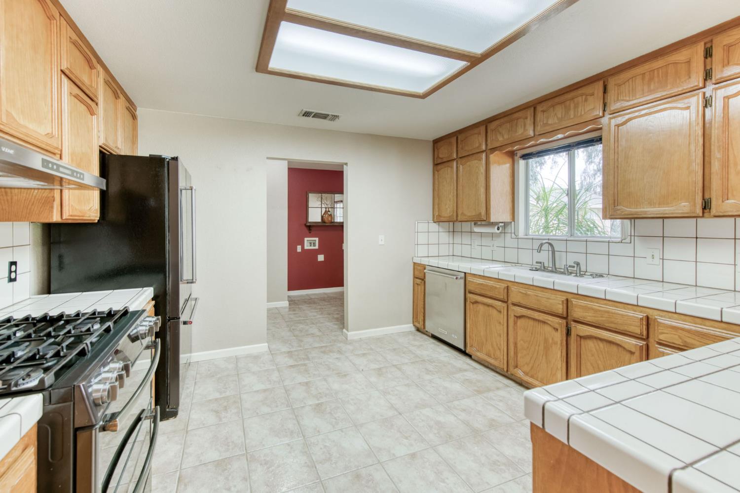 16036 South Del Rey Avenue Kingsburg, CA 93631 - Photo 23 of 64 a kitchen with stainless steel appliances granite countertop a sink stove and refrigerator