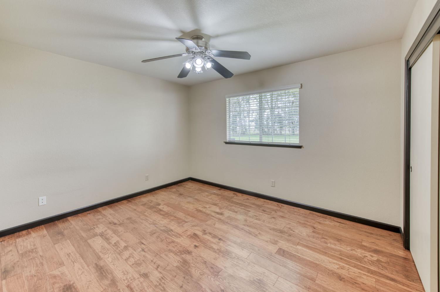 16036 South Del Rey Avenue Kingsburg, CA 93631 - Photo 28 of 64 a view of an empty room with a window