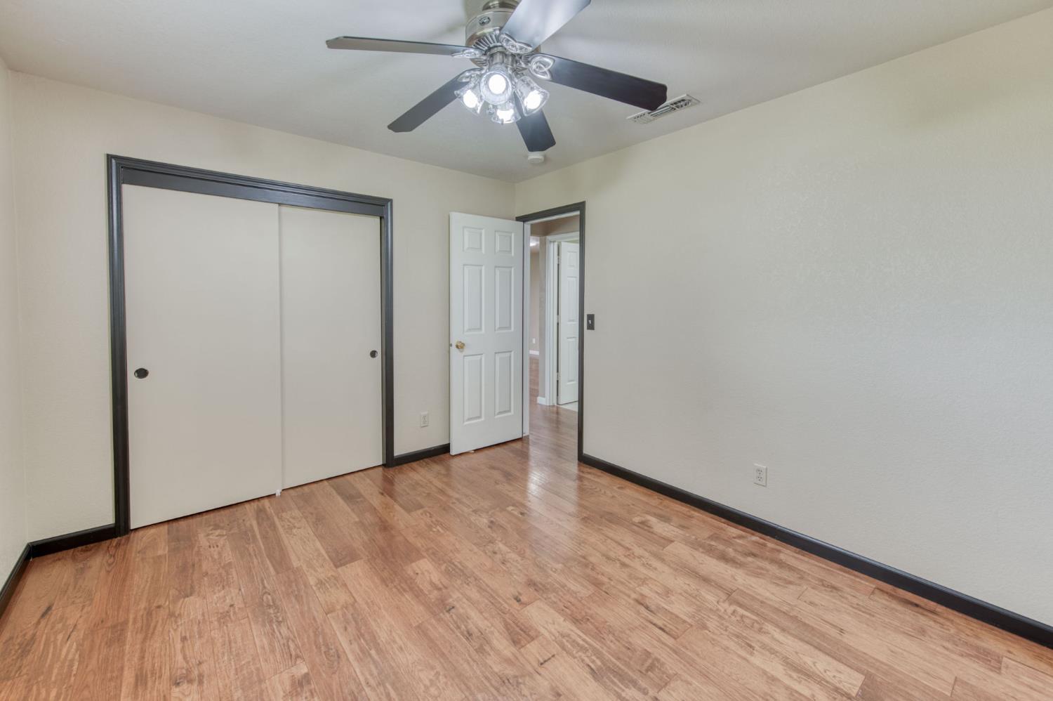 16036 South Del Rey Avenue Kingsburg, CA 93631 - Photo 29 of 64 a view of an empty room and chandelier fan