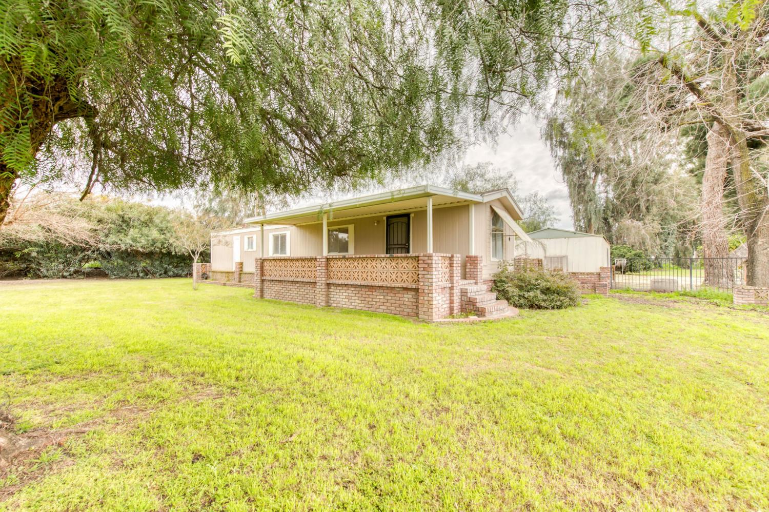 16036 South Del Rey Avenue Kingsburg, CA 93631 - Photo 42 of 64 a house view with swimming pool in front of it