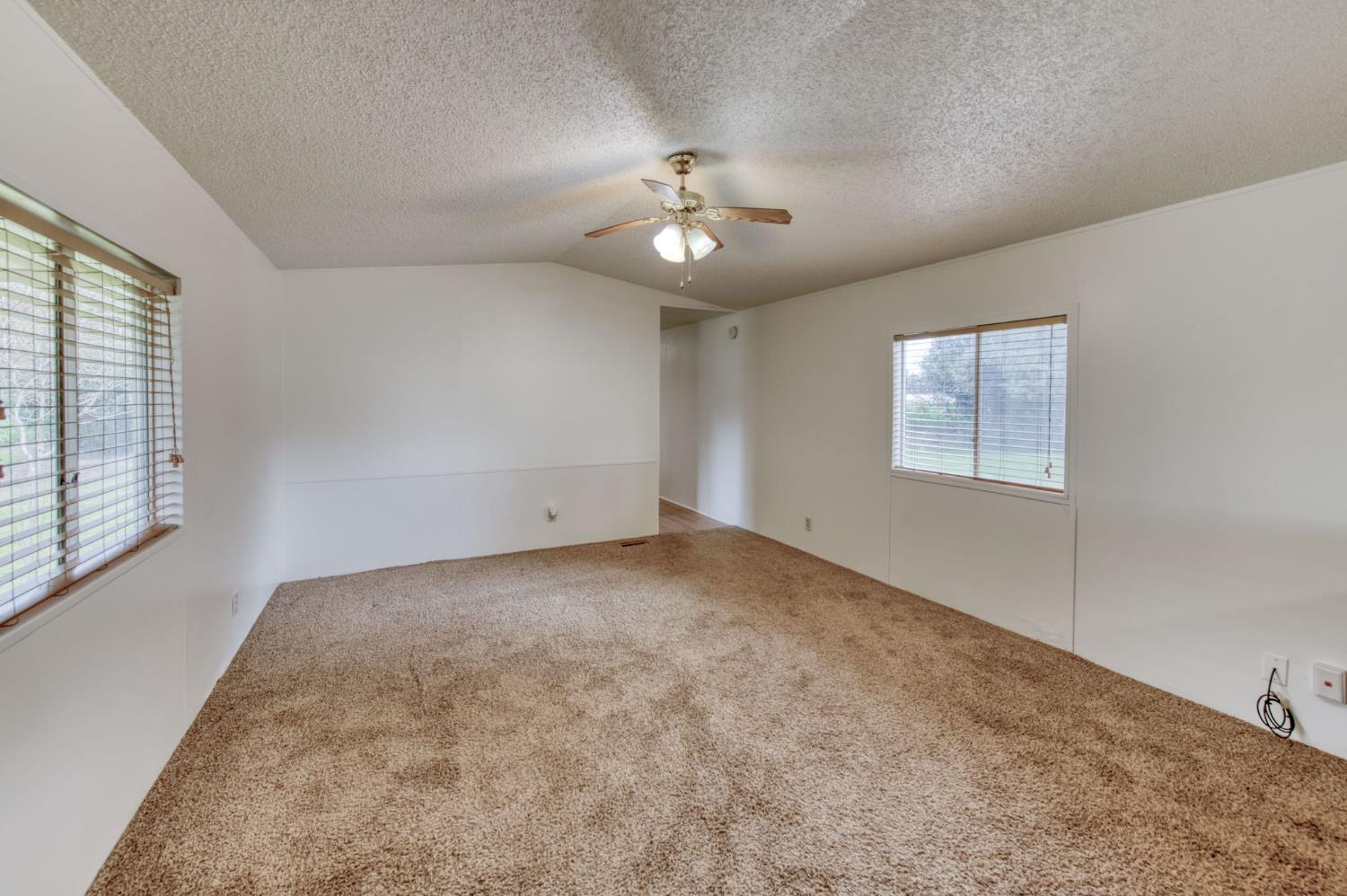 16036 South Del Rey Avenue Kingsburg, CA 93631 - Photo 46 of 64 wooden floor in an empty room with a window