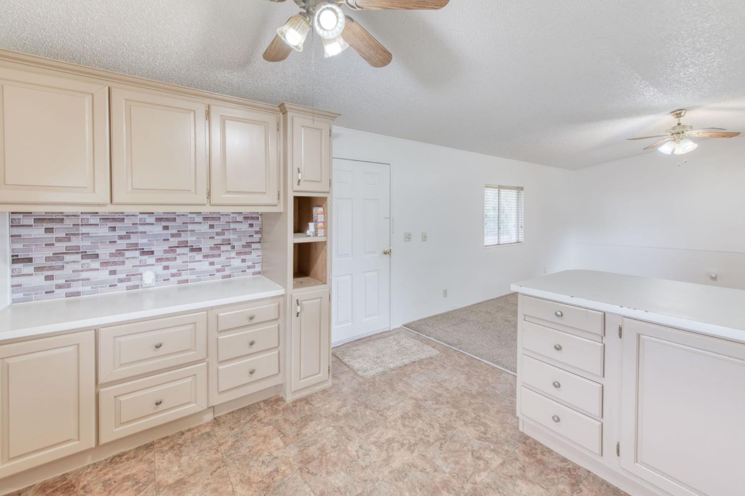 16036 South Del Rey Avenue Kingsburg, CA 93631 - Photo 48 of 64 wooden floor with white cabinets and window