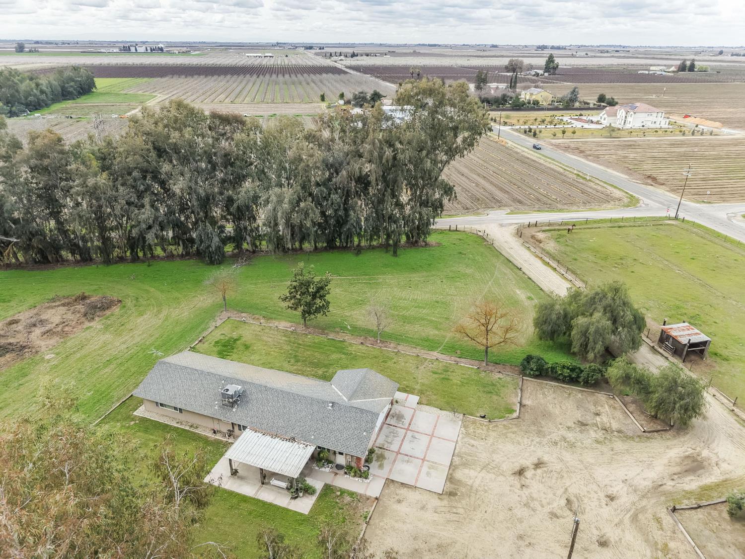 16036 South Del Rey Avenue Kingsburg, CA 93631 - Photo 64 of 64 an aerial view of a house with a yard and lake view