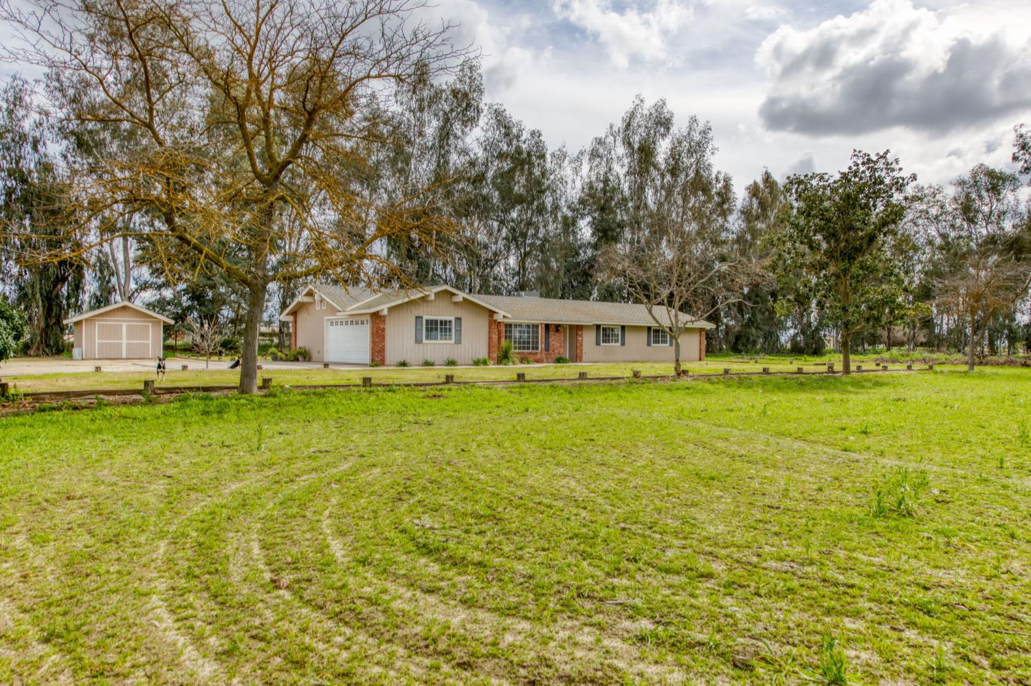 16036 South Del Rey Avenue Kingsburg, CA 93631 - Photo 9 of 64 a view of house with garden