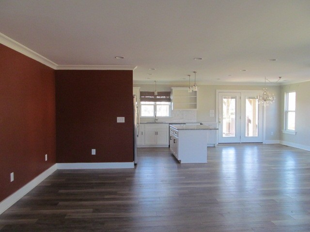 1158 Neal Road Watertown, TN 37184 - Photo 3 of 15 an empty room with wooden floor and windows