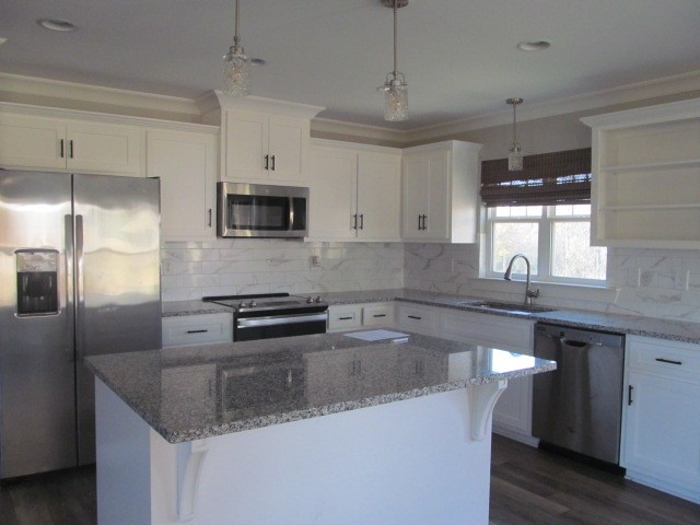1158 Neal Road Watertown, TN 37184 - Photo 5 of 15 a kitchen with a center island and stainless steel appliances