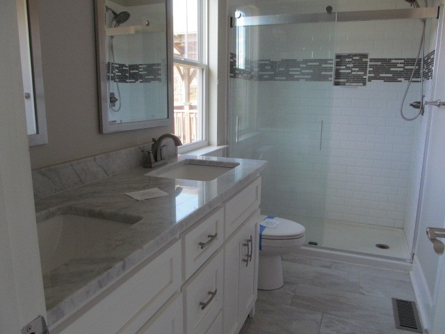 1158 Neal Road Watertown, TN 37184 - Photo 10 of 15 a bathroom with a granite countertop sink toilet and shower