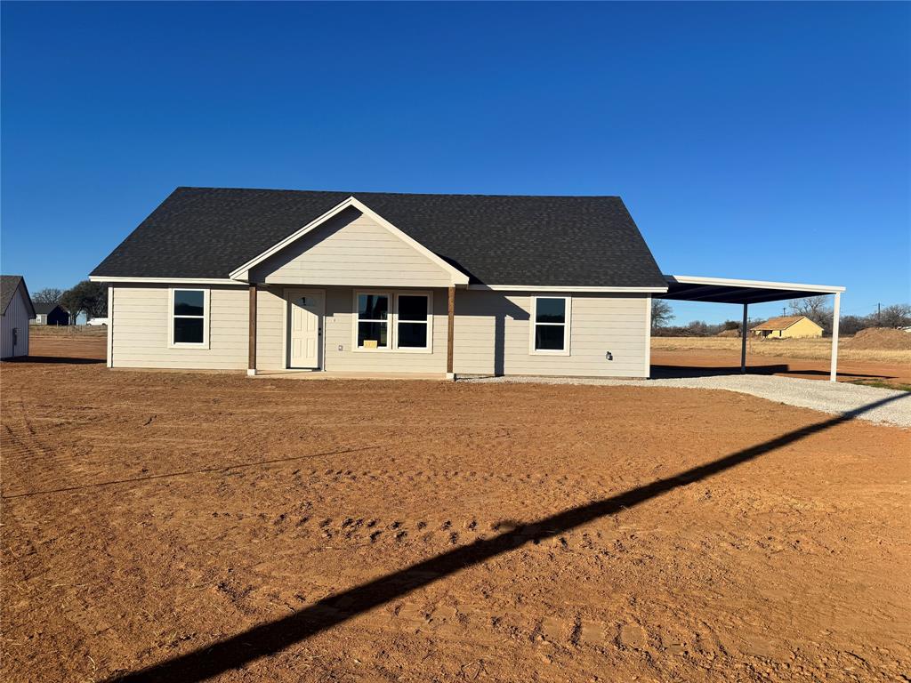 1004 Morgan Court Springtown, TX 76082 - Photo 1 of 8 a house with trees in the background