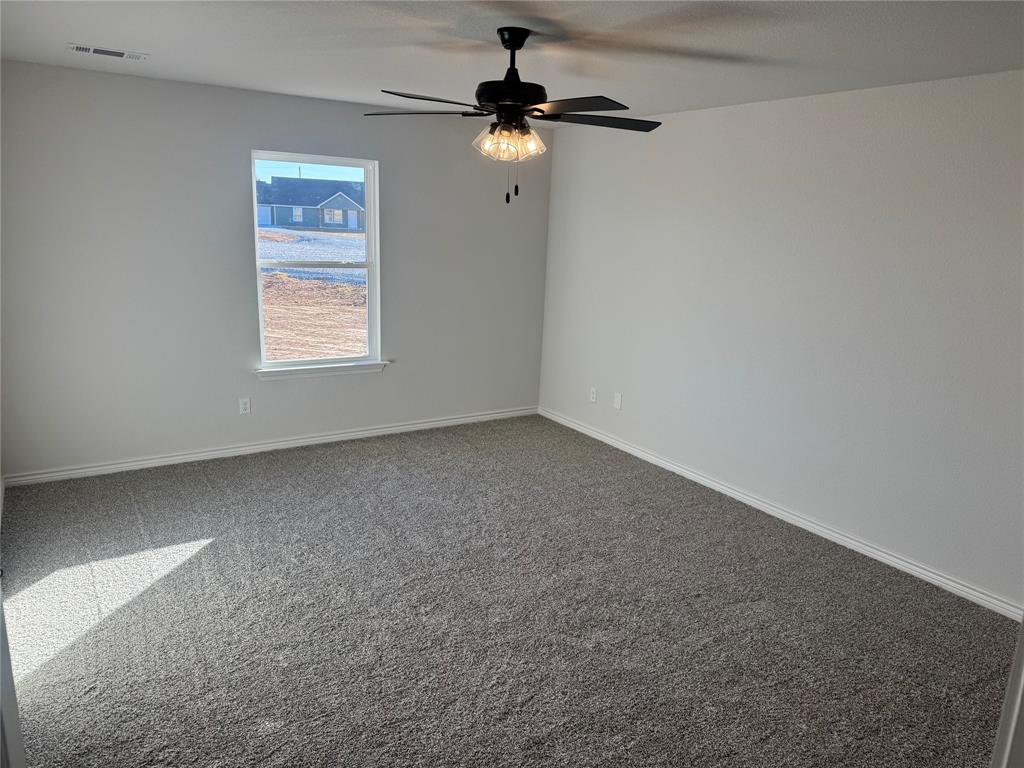1004 Morgan Court Springtown, TX 76082 - Photo 5 of 8 an empty room with a window