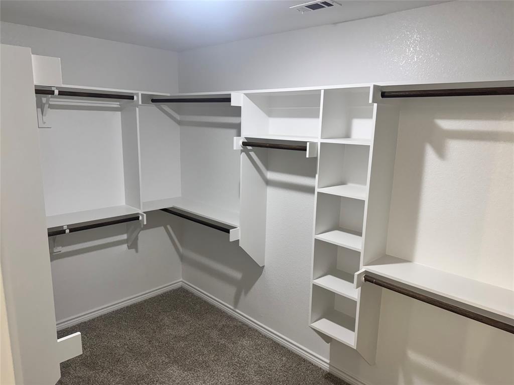 1004 Morgan Court Springtown, TX 76082 - Photo 7 of 8 a view of an empty walk in closet