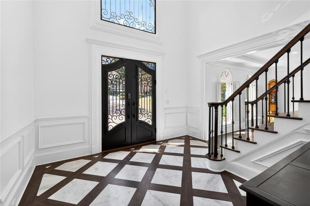 1026 Quaker Ridge Way Johns Creek, GA 30097 - Photo 3 of 80 a view of an entryway with wooden floor