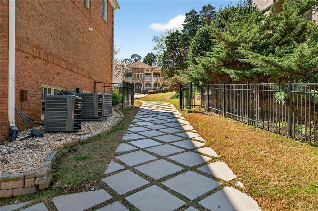 1026 Quaker Ridge Way Johns Creek, GA 30097 - Photo 66 of 80 a view of swimming pool with a patio