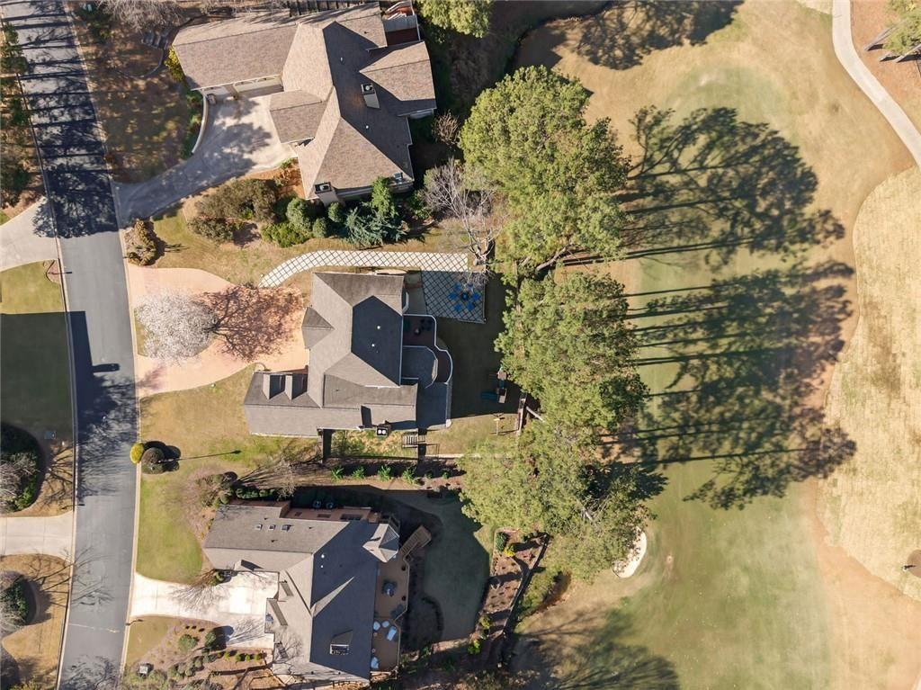 1026 Quaker Ridge Way Johns Creek, GA 30097 - Photo 74 of 80 an aerial view of residential houses with outdoor space