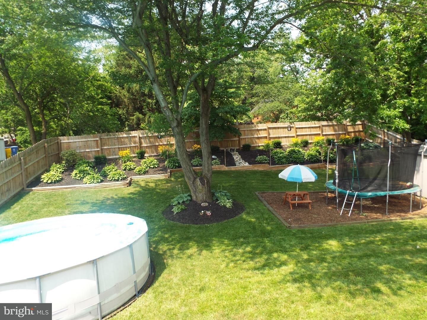 7 Ohio State Drive Riverside, NJ 08075 - Photo 3 of 25 a view of a swimming pool with sitting area