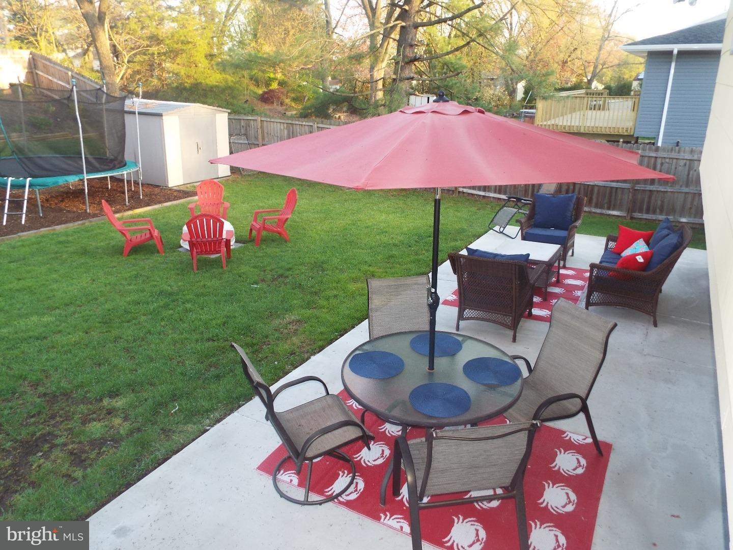 7 Ohio State Drive Riverside, NJ 08075 - Photo 5 of 25 a backyard of a house with table and chairs