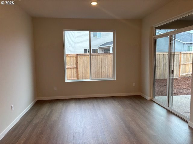 1585 Young Street Lafayette, OR 97127 - Photo 12 of 23 an empty room with wooden floor and windows