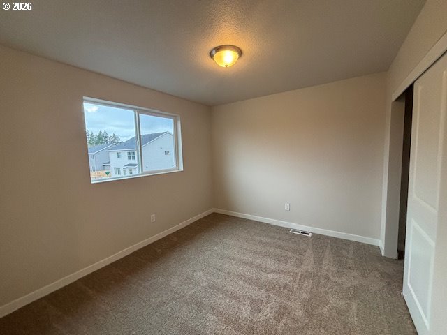 1585 Young Street Lafayette, OR 97127 - Photo 16 of 23 an empty room with windows and mirror