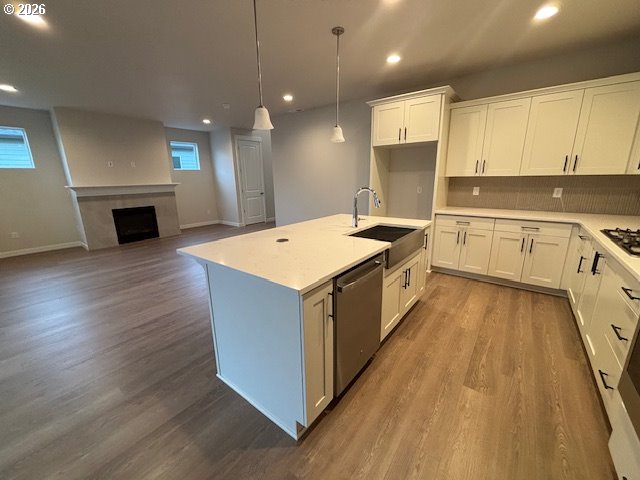1585 Young Street Lafayette, OR 97127 - Photo 5 of 23 a kitchen with a sink stove and wooden floor
