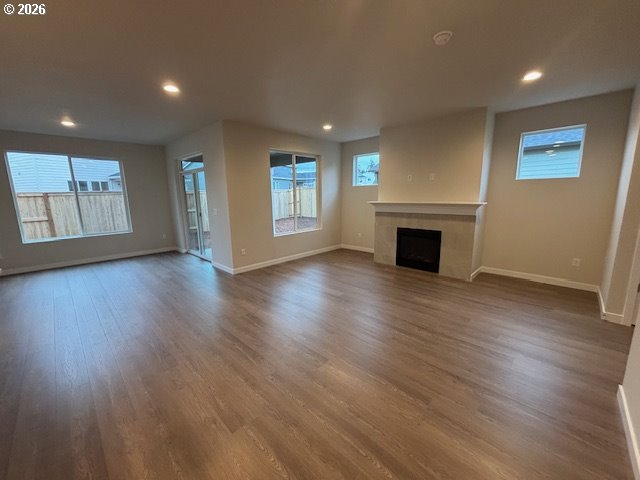 1585 Young Street Lafayette, OR 97127 - Photo 8 of 23 an empty room with wooden floor fireplace and windows