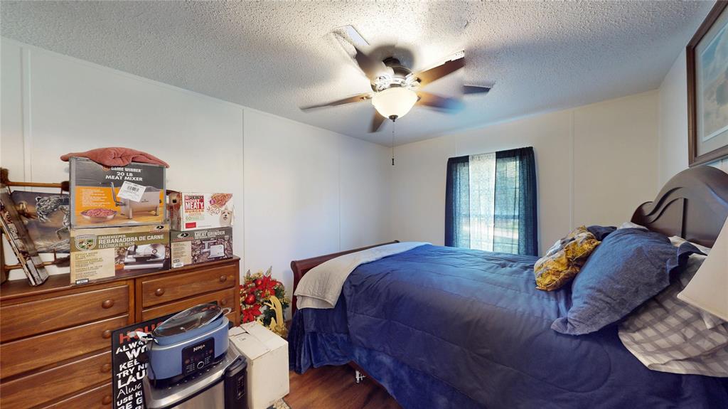670 Arbin Culpepper Road Jonesboro, LA 71251 - Photo 14 of 17 a bedroom with a bed and dresser