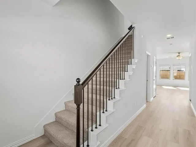 a front view of a house with large windows
