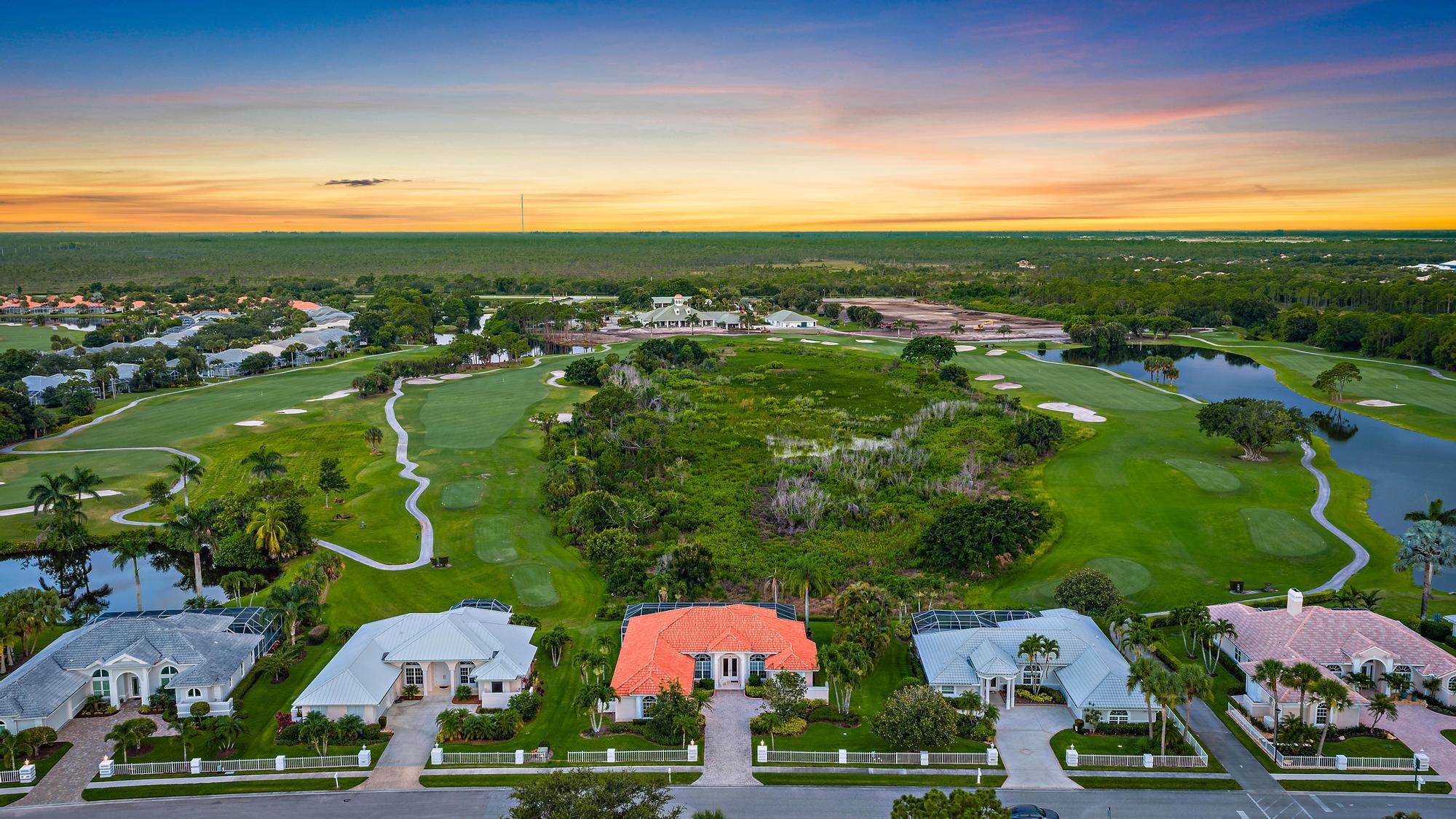 8157 Southeast Double Tree Drive Hobe Sound, FL 33455 - Photo 34 of 46 an aerial view of residential houses with outdoor space and street view