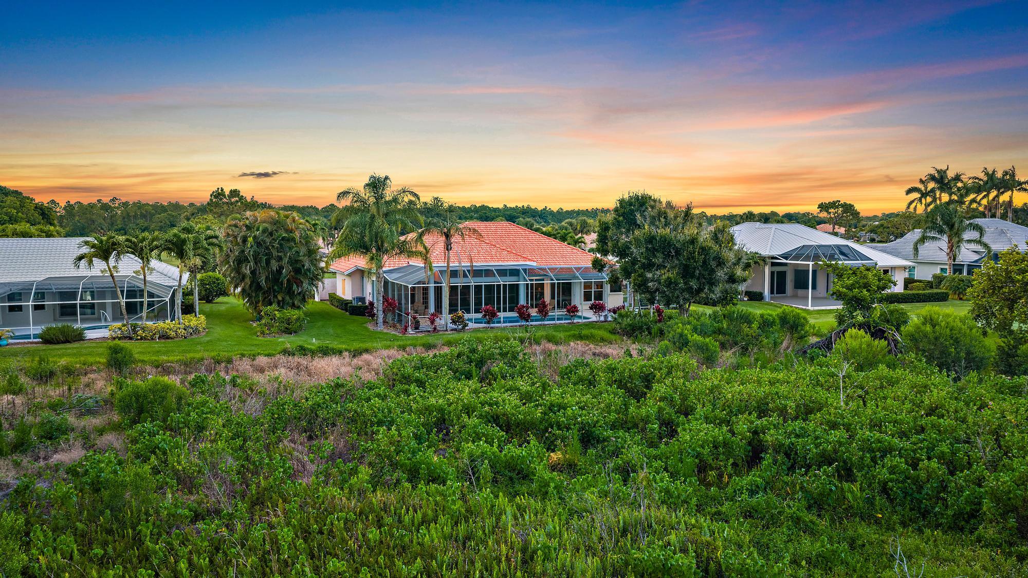 8157 Southeast Double Tree Drive Hobe Sound, FL 33455 - Photo 37 of 46 a view of a house with a big yard