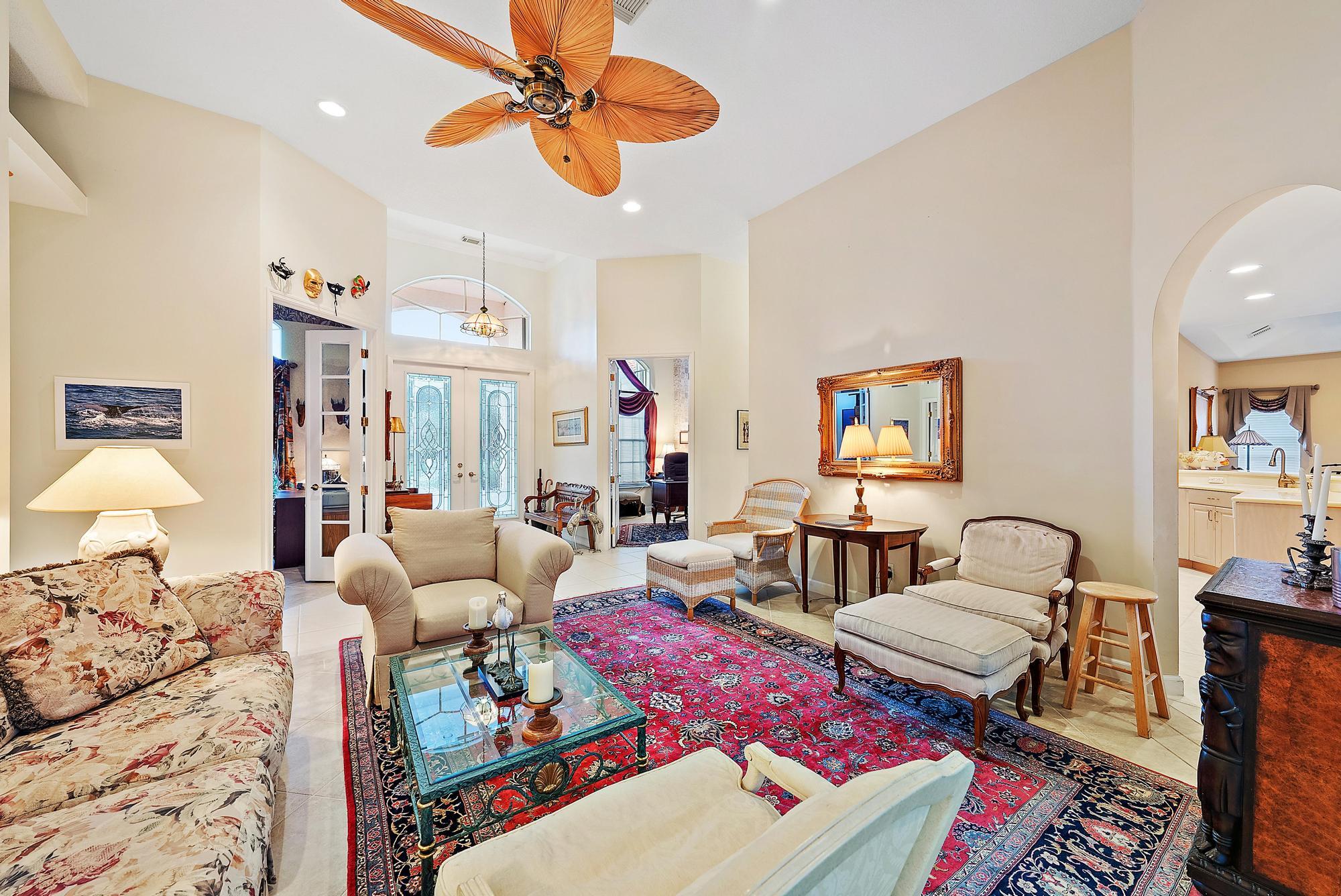 8157 Southeast Double Tree Drive Hobe Sound, FL 33455 - Photo 5 of 46 a living room with furniture and wooden floor