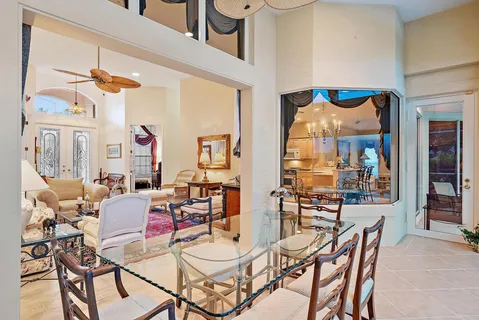a view of a dining room with furniture wooden floor and a chandelier